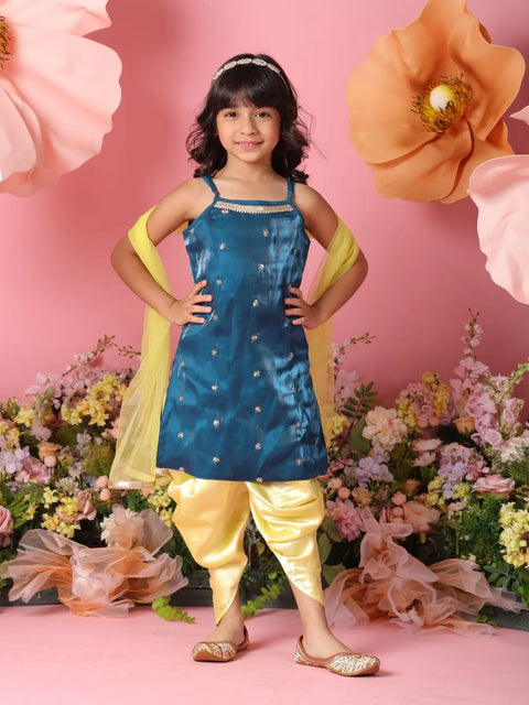 Young girl in a blue and yellow traditional outfit with flowers in the background