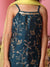 Blue embroidered dress with gold details on a pink background