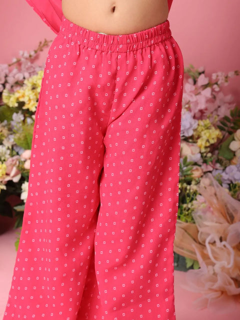 Pink patterned pants with a blurred floral background