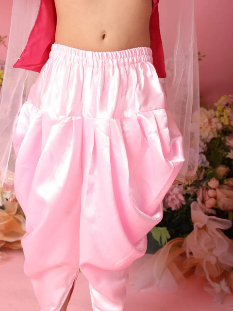 Pink satin pants with a blurred background
