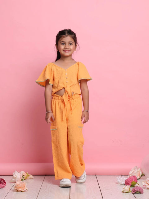 stylish-orange-girls-co-ord-set-with-front-knot-top-relaxed-pants-summer-outfit-by-saka-designs