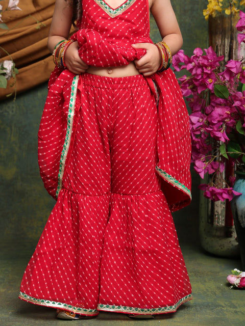 girls-red-bandhani-halter-kurti-with-layered-sharara
