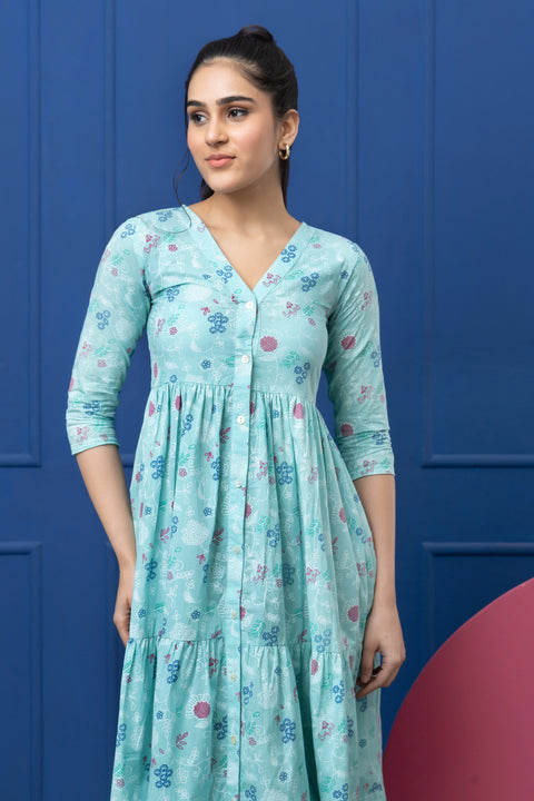Woman wearing a light blue floral dress against a blue background