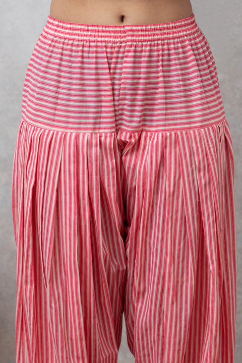 Red and white striped pants on a plain background
