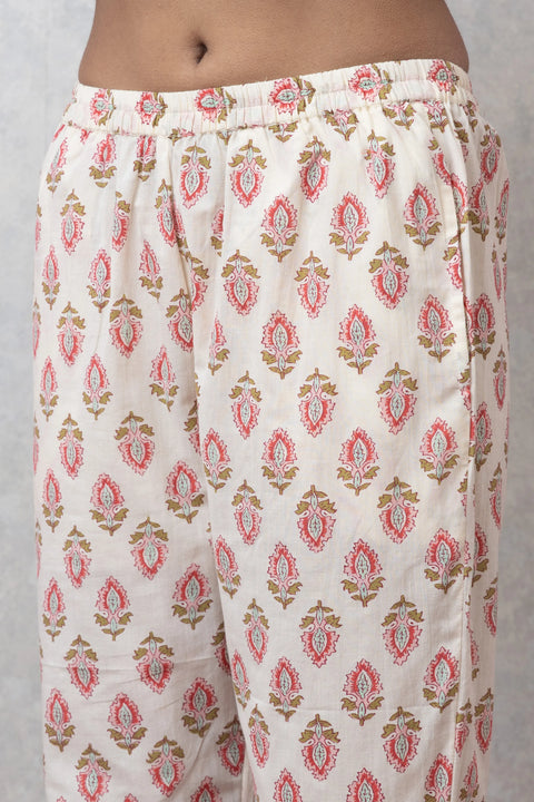 Floral patterned pants on a plain background