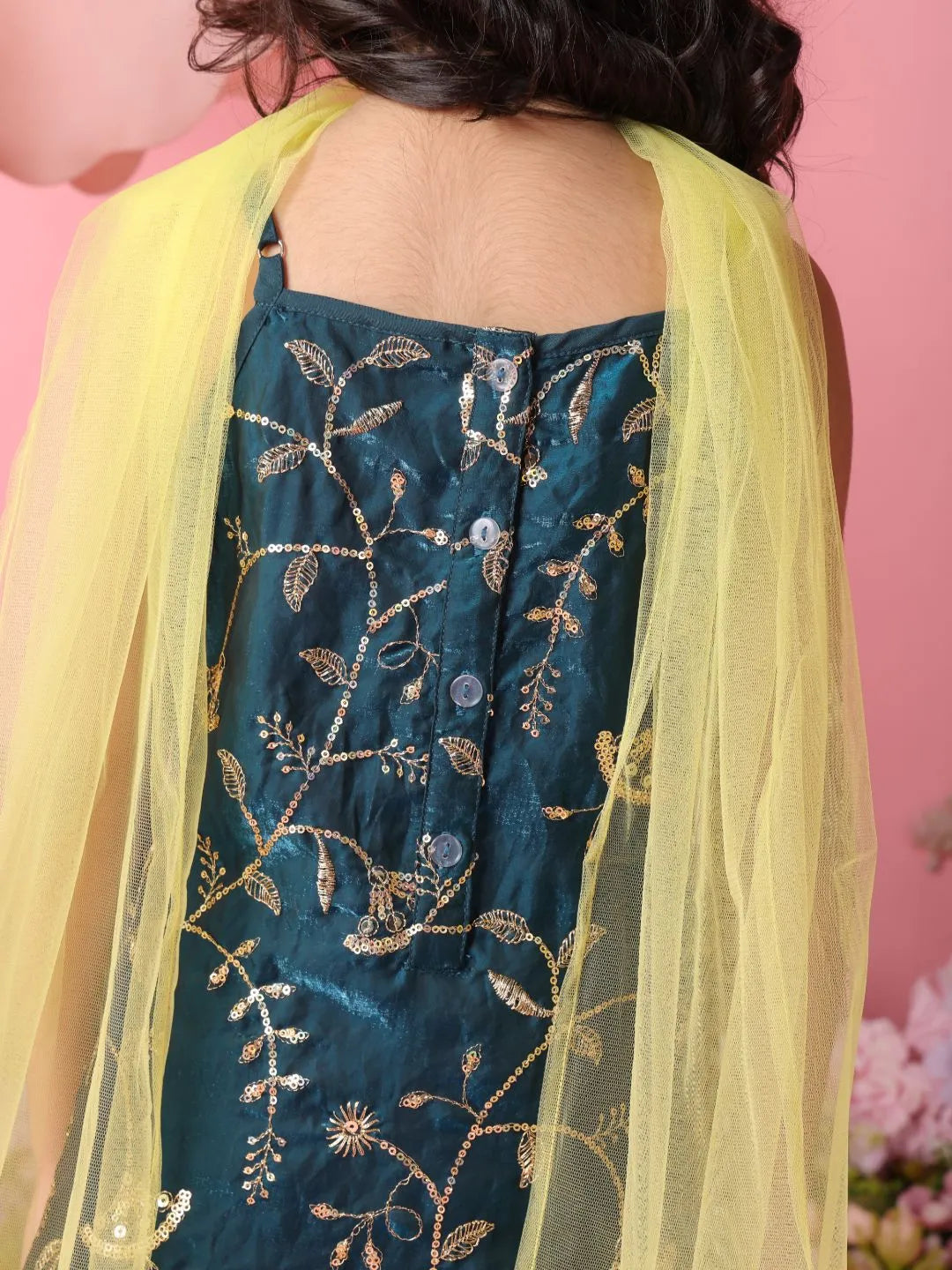 Teal embroidered dress with yellow dupatta on a pink background