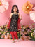 Young girl in a black and red traditional outfit with flowers and pink background