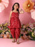 Young girl in a red traditional outfit with flowers and pink background