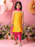 Young girl in yellow and pink traditional outfit with floral decorations and flowers in the background