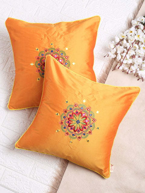 Square mustard cushion cover featuring ethnic motif embroidery, ideal for traditional and contemporary home décor settings.