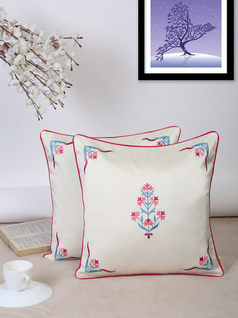 Square ivory cushion cover featuring intricate Mughal embroidery, perfect for elegant home décor.